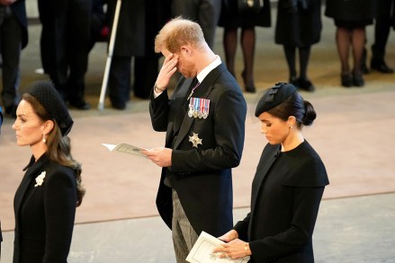 Catherine, Princess of Wales, Prince Harry, Duke of Sussex and Meghan, Duchess of Sussex pay their respects at the Palace of Westminster after the procession for the lie - in the state of Queen Elizabeth II on September 14, 2022 in London, England. The coffin of Queen Elizabeth II is taken in a procession on a gun carriage of the King's Troop Royal Horse Artillery from Buckingham Palace to Westminster Hall where she will remain in state until the early morning of her funeral.Queen Elizabeth II died at Balmoral Castle in Scotland on September 8, 2022, and was succeeded by her eldest son, King Charles III. Queen Elizabeth II from Buckingham Palace to Westminster Hall, London, United Kingdom - September 14, 2022